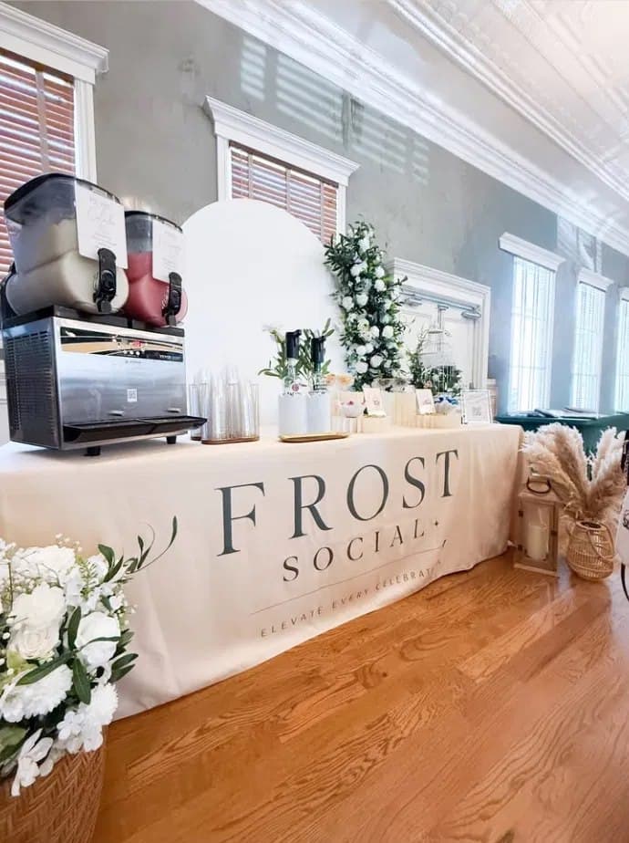 Indoor mansion room with branded linen table and floral column